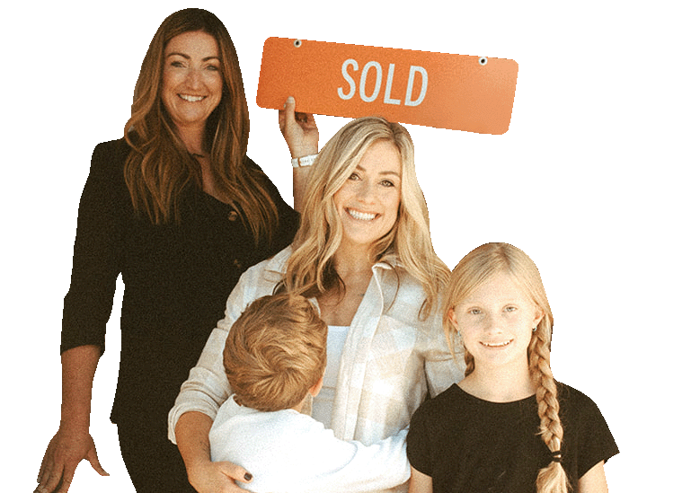 Family holding a sold sign